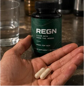 Two REGN capsules in an open hand